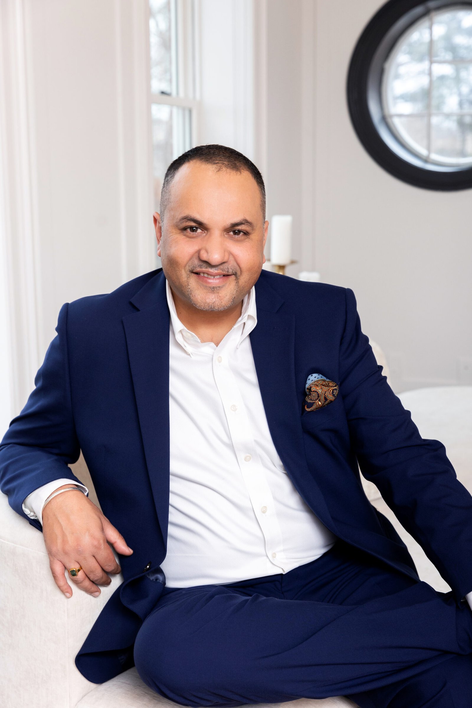 Sumant Sarin, real estate professional, in a navy suit