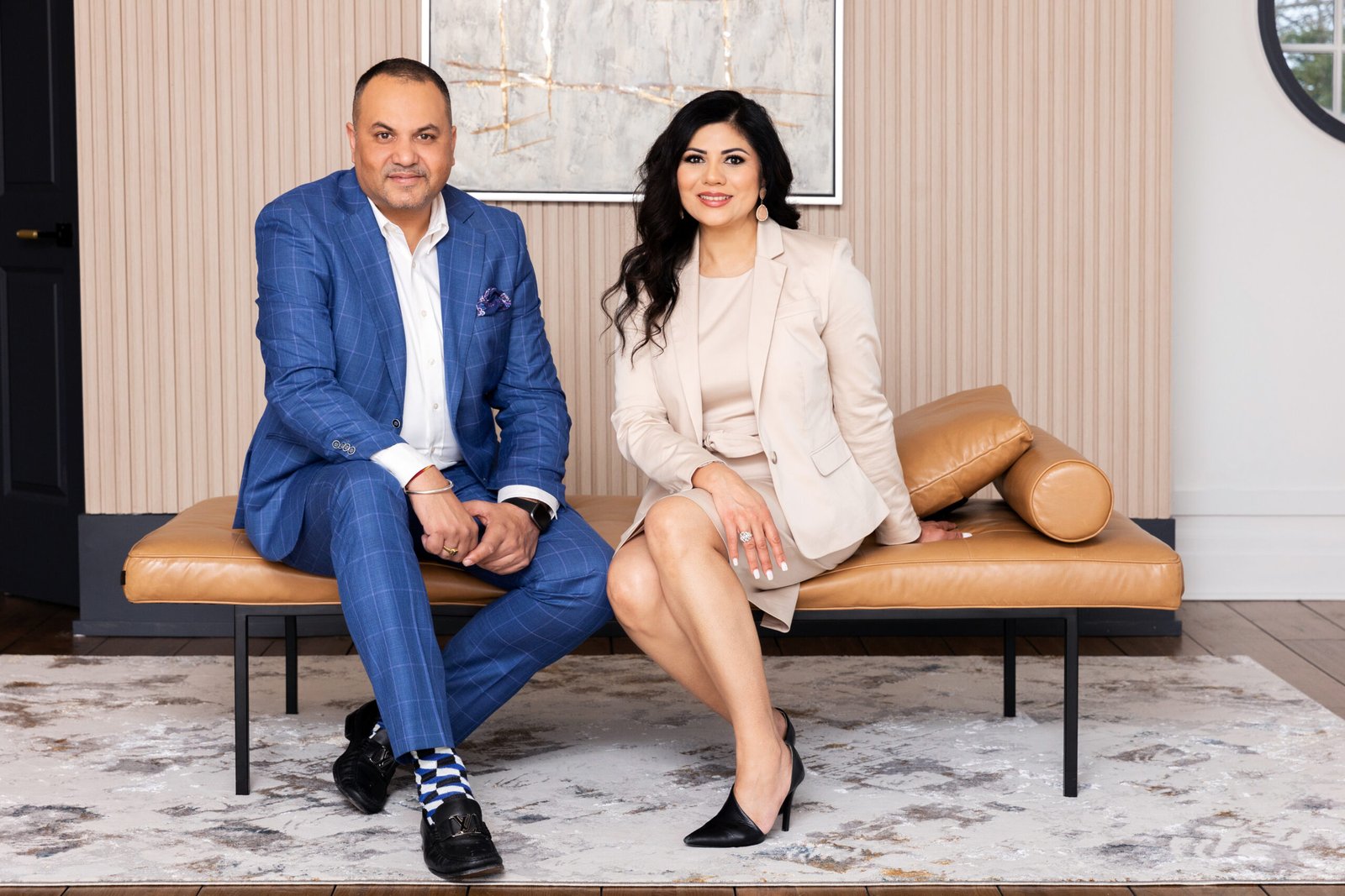 Sumant and Shelley Sarin, real estate team with Royal LePage PRG, seated together